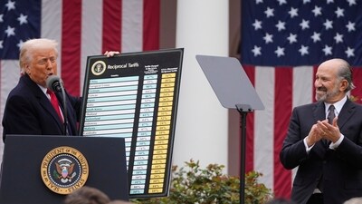 US President Donald Trump announced sweeping new tariffs on several countries on Wednesday in the Rose Garden at the White House as Commerce Secretary Howard Lutnick listened. The world reacted to the unprecedented move. (AP) US President Donald Trump announced sweeping new tariffs on several countries on Wednesday in the Rose Garden at the White House as Commerce Secretary Howard Lutnick listened. The world reacted to the unprecedented move. (AP)