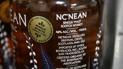 A bottle of Nc'nean Organic Single Malt Whisky, labelled for export to the USA, is pictured at their distillery in Drimnin, in the western highlands of Scotland. (AFP) A bottle of Nc'nean Organic Single Malt Whisky, labelled for export to the USA, is pictured at their distillery in Drimnin, in the western highlands of Scotland. (AFP)