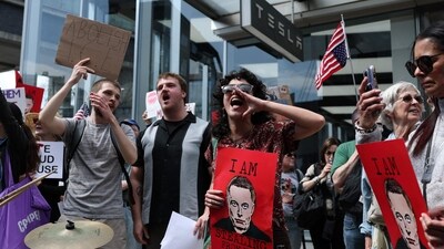 Demonstrators rally against Tesla CEO Elon Musk during a "Tesla Takedown" protest outside a Tesla Store in New York on March 29, 2025. (Charly Triballeau/AFP) Demonstrators rally against Tesla CEO Elon Musk during a "Tesla Takedown" protest outside a Tesla Store in New York on March 29, 2025. (Charly Triballeau/AFP)