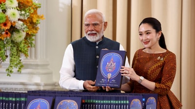 India's Prime Minister Narendra Modi and Thailand's Prime Minister Paetongtarn Shinawatra pose with a book at the Government House, in Bangkok, Thailand. (Reuters)