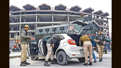 Police personnel check a vehicle amid heightened security across the UT, in Srinagar on Thursday (ANI) Police personnel check a vehicle amid heightened security across the UT, in Srinagar on Thursday (ANI)