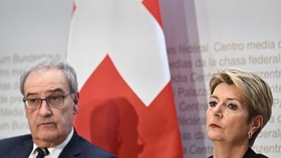 Swiss President Karin Keller-Sutter (R) and Swiss Economy Minister Guy Parmelin address a press conference on US tariffs in Bern on April 3, 2025. Switzerland is not planning to retaliate against the steep tariffs announced by US President Donald Trump "at this stage", the country's government announced. (AFP) Swiss President Karin Keller-Sutter (R) and Swiss Economy Minister Guy Parmelin address a press conference on US tariffs in Bern on April 3, 2025. Switzerland is not planning to retaliate against the steep tariffs announced by US President Donald Trump "at this stage", the country's government announced. (AFP)