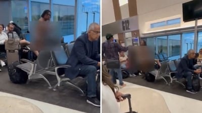 A woman started taking off her clothes while waiting at an airport. (Screengrab) A woman started taking off her clothes while waiting at an airport. (Screengrab)