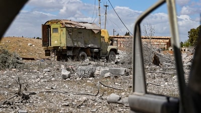 Debris is scattered at the site of an Israeli strike on a military airbase near Hama in Syria. (AP) Debris is scattered at the site of an Israeli strike on a military airbase near Hama in Syria. (AP)