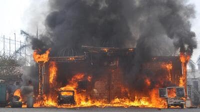 The banquet hall on fire in Raj Nagar Extension on Thursday afternoon. Two vehicles were also gutted in the fire that is believed to have started from a short-circuit. (Sakib Ali /HT Photo) The banquet hall on fire in Raj Nagar Extension on Thursday afternoon. Two vehicles were also gutted in the fire that is believed to have started from a short-circuit. (Sakib Ali /HT Photo)