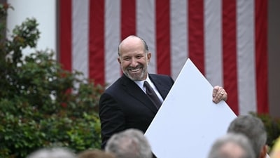 US Secretary of Commerce Howard Lutnick holds a chart as unseen US President Donald Trump delivers remarks on reciprocal tariffs during an event in the Rose Garden entitled "Make America Wealthy Again" at the White House in Washington, DC, on April 2, 2025. Trump geared up to unveil sweeping new "Liberation Day" tariffs in a move that threatens to ignite a devastating global trade war. Key US trading partners including the European Union and Britain said they were preparing their responses to Trump's escalation, as nervous markets fell in Europe and America. (Photo by Brendan SMIALOWSKI / AFP) (AFP) US Secretary of Commerce Howard Lutnick holds a chart as unseen US President Donald Trump delivers remarks on reciprocal tariffs during an event in the Rose Garden entitled "Make America Wealthy Again" at the White House in Washington, DC, on April 2, 2025. Trump geared up to unveil sweeping new "Liberation Day" tariffs in a move that threatens to ignite a devastating global trade war. Key US trading partners including the European Union and Britain said they were preparing their responses to Trump's escalation, as nervous markets fell in Europe and America. (Photo by Brendan SMIALOWSKI / AFP) (AFP)