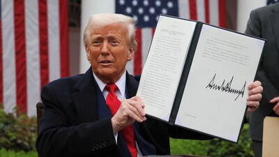 US President Donald Trump holds a signed executive order on tariffs, in the Rose Garden at the White House in Washington DC, US, on April 2, 2025. (File/REUTERS)