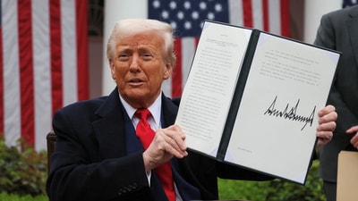 US President Donald Trump signed the executive order on tariffs during his press conference at the White House's Rose Garden. (Reuters)