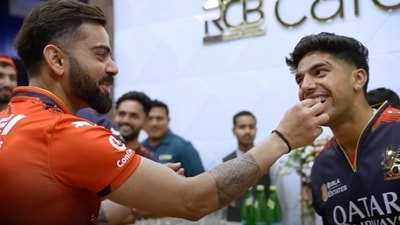 Virat Kohli (L) and Swastik Chikara (RCB) Virat Kohli (L) and Swastik Chikara (RCB)