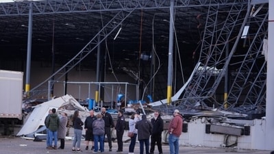 In Owasso, Oklahoma, a violent storm struck early in the morning on April 2, shattering roofs and bringing down trees, fences, and power lines off 96th Street North close to Garnett Road.  (AP )
