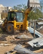 A demolition drive carried out by the Haryana Shahari Vikas Pradhikaran (HSVP) on a three acre plot in Sector 57 in Gurugram. (HT PHOTO)