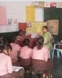 A teacher busy teaching kids in a government-run primary school in Prayagraj. (File) A teacher busy teaching kids in a government-run primary school in Prayagraj. (File)