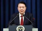 Impeached South Korean President Yoon Suk Yeol speaks during a press briefing at the presidential office in Seoul, South Korea.