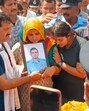 The parents and younger sister of flight lieutenant Siddharth Yadav holding his photo at his cremation in their native village of Majra Bhalkhi in Rewari district of Haryana on Friday. (HT Photo) The parents and younger sister of flight lieutenant Siddharth Yadav holding his photo at his cremation in their native village of Majra Bhalkhi in Rewari district of Haryana on Friday. (HT Photo)