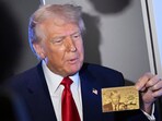 President Donald Trump holds up the $5 million gold card as he speaks to reporters while in flight on board Air Force One, en route to Miami, Thursday, April 3, 2025. President Donald Trump holds up the $5 million gold card as he speaks to reporters while in flight on board Air Force One, en route to Miami, Thursday, April 3, 2025.