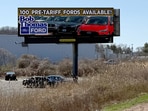 A sign advertising Ford vehicles for sale before any potential tariffs take effect stands by the side of a highway in North Haven, Connecticut, U.S. April 1, 2025.  Mel Yu/Handout via REUTERS.