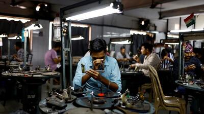Craftsmen work on diamonds inside a diamond processing unit in Surat, on April 3 (REUTERS) Craftsmen work on diamonds inside a diamond processing unit in Surat, on April 3 (REUTERS)