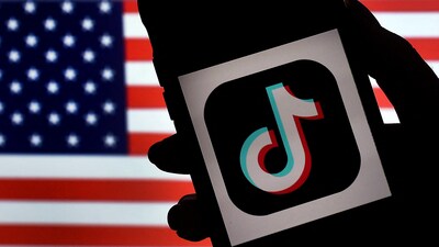 (FILES) In this photo illustration, the social media application logo, TikTok is displayed on the screen of an iPhone on an American flag background on August 3, 2020 in Arlington, Virginia. (AFP) (FILES) In this photo illustration, the social media application logo, TikTok is displayed on the screen of an iPhone on an American flag background on August 3, 2020 in Arlington, Virginia. (AFP)