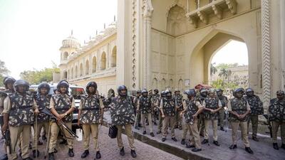 Police personnel stand guard outside Bada Imambada, after the passage of the Waqf (Amendment) Bill, in Lucknow, Friday. (PTI Photo) Police personnel stand guard outside Bada Imambada, after the passage of the Waqf (Amendment) Bill, in Lucknow, Friday. (PTI Photo)