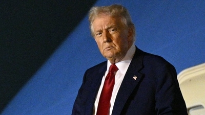 US President Donald Trump steps off Air Force One upon arrival at Palm Beach International Airport in West Palm Beach, Florida on April 3, 2025. Trump is heading to his Mar-a-Lago resort. (AFP)