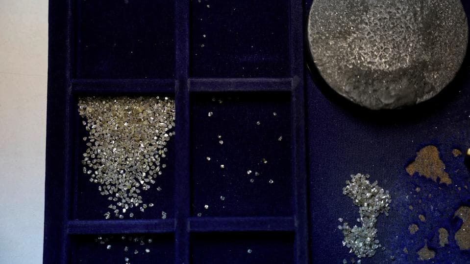 Diamonds are separated in a tray inside a diamond processing unit in Surat (REUTERS) Diamonds are separated in a tray inside a diamond processing unit in Surat (REUTERS)