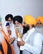 Akal Takht acting Jathedar Giani Kuldeep Singh Gargaj (R) talking to Gurmeet Kaur, wife of Babbar Khalsa militant who died in Pakistan, during his bhog ceremony on Friday. (HT)