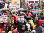 People take part in the nationwide "Hands Off" anti-Trump protests in Boston,