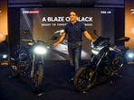 TVS Motor quarter results: Vimal Sumbly, Head Business - Premium, TVS Motor Company poses for photographs with TVS Apache RTR 160 4V and TVS Apache RTR 160, in Hyderabad.(PTI)