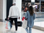 Shoppers walk past a Nike store, as global markets brace for a hit to trade and growth caused by U.S. President Donald Trump's decision to impose import tariffs on dozens of countries, in the King of Prussia Mall in King of Prussia, Pennsylvania, U.S., April 3, 2025.  