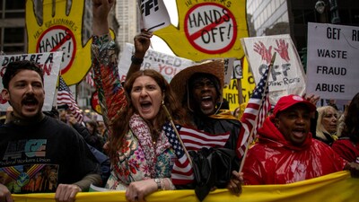People take part in a nationwide "Hands Off!" anti-Trump protest in New York City (REUTERS)