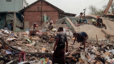 People sort through the rubble of a collapsed building in Mandalay on April 5, 2025, following the March 28 earthquake. (AFP) People sort through the rubble of a collapsed building in Mandalay on April 5, 2025, following the March 28 earthquake. (AFP)