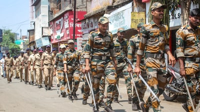 Police personnel conduct a route march ahead of the Ram Navami festival, in Solapur, Maharashtra. (PTI) Police personnel conduct a route march ahead of the Ram Navami festival, in Solapur, Maharashtra. (PTI)