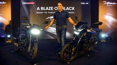 TVS Motor quarter results: Vimal Sumbly, Head Business - Premium, TVS Motor Company poses for photographs with TVS Apache RTR 160 4V and TVS Apache RTR 160, in Hyderabad. (PTI)