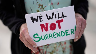 Protests against President Trump's actions are set for April 5, 2025, under the 'Hands Off' banner. ( (AP Photo/Armando Franca)) Protests against President Trump's actions are set for April 5, 2025, under the 'Hands Off' banner. ( (AP Photo/Armando Franca))