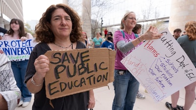 Amy Zeno, left, joins the Hands Off Our Schools rally outside the Department of Education building, Friday, April 4, 2025, in Washington. (AP Photo/Manuel Balce Ceneta) (AP) Amy Zeno, left, joins the Hands Off Our Schools rally outside the Department of Education building, Friday, April 4, 2025, in Washington. (AP Photo/Manuel Balce Ceneta) (AP)