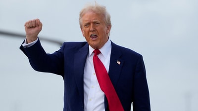 US President Donald Trump gestures as he disembarks Air Force One. (Reuters file photo)