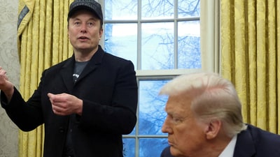 Elon Musk speaks as US President Donald Trump listens in the Oval Office of the White House in Washington, D.C., on February 11, 2025. (REUTERS)