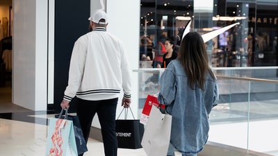 Shoppers walk past a Nike store, as global markets brace for a hit to trade and growth caused by U.S. President Donald Trump's decision to impose import tariffs on dozens of countries, in the King of Prussia Mall in King of Prussia, Pennsylvania, U.S., April 3, 2025. (REUTERS)