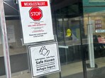 A measles alert sign hangs outside the entrance to the Cohen Children's Medical Center, where the state health department confirmed that a baby tested positive and that there is a possibility of exposure to others at the facility, in New Hyde Park, New York, U.S.