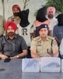 The accused in police custody along with recovered illegal weapons in Ludhiana on Saturday. (HT Photo)
