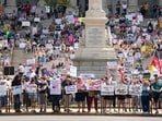 Demonstrators participate in a Hands Off protest at the statehouse on April 5, 2025 in Columbia, South Carolina. Protests against Trump administration policies and Elon Musk's Department of Government Efficiency (DOGE) are being held nationwide. Demonstrators participate in a Hands Off protest at the statehouse on April 5, 2025 in Columbia, South Carolina. Protests against Trump administration policies and Elon Musk's Department of Government Efficiency (DOGE) are being held nationwide.