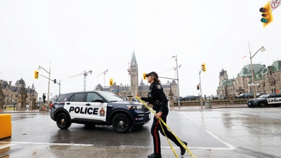A police officer secures the perimeter of Canada's Parliament after declaring a lockdown, in Ottawa, Ontario, Canada, April 5, 2025. (REUTERS)