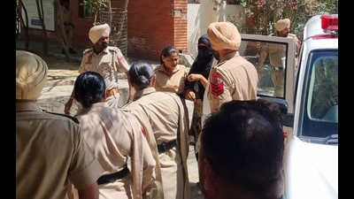 Dismissed senior police constable Amandeep Kaur being brought to the court on Sunday. (Sanjeev Kumar/HT) Dismissed senior police constable Amandeep Kaur being brought to the court on Sunday. (Sanjeev Kumar/HT)