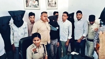 Fatehabad SP Astha Modi, on Sunday, with seven accused held in connection with murder of an operator of SBI’s Grahak Sewa Kendra at Thuyan village. (HT Photo)