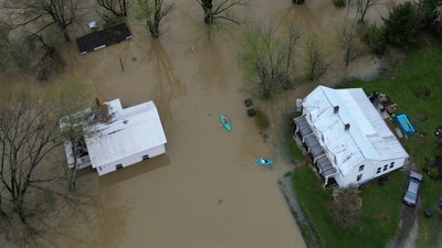 Kayakers deliver supplies as the rising waters of the Kentucky River flood Monterey, Ky. Sunday, April 6, 2025. (AP) Kayakers deliver supplies as the rising waters of the Kentucky River flood Monterey, Ky. Sunday, April 6, 2025. (AP)
