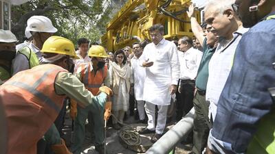 PWD minister Parvesh Verma overseeing sewer cleaning work with a new machine at Zamrudpur village on Sunday. (Sanjeev Verma/HT Photo) PWD minister Parvesh Verma overseeing sewer cleaning work with a new machine at Zamrudpur village on Sunday. (Sanjeev Verma/HT Photo)