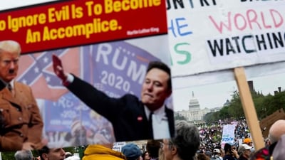  Protesters gather on the National Mall for the nationwide "Hands Off!" protest against US President Donald Trump and his advisor, Tesla CEO Elon Musk, in Washington, DC, on April 5, 2025. Thousands of people descended on Washington's National Mall and other cities across the United States in opposition to the policies of Donald Trump, in the largest protests since he returned to the presidency. (AFP)