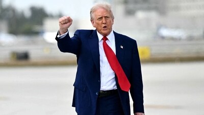US President Donald Trump pumps his fist upon arrival at Miami International Airport. (AFP) US President Donald Trump pumps his fist upon arrival at Miami International Airport. (AFP)