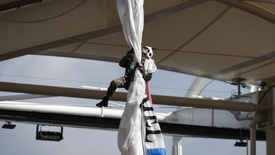 A parachutist clinging from the stadium roof in Toulouse (AFP) A parachutist clinging from the stadium roof in Toulouse (AFP)