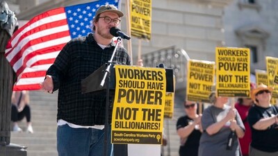  Representatives of the South Carolina Workers Party participate in a Hands Off protest at the statehouse on April 5, 2025 in Columbia, South Carolina.  (Getty Images via AFP)